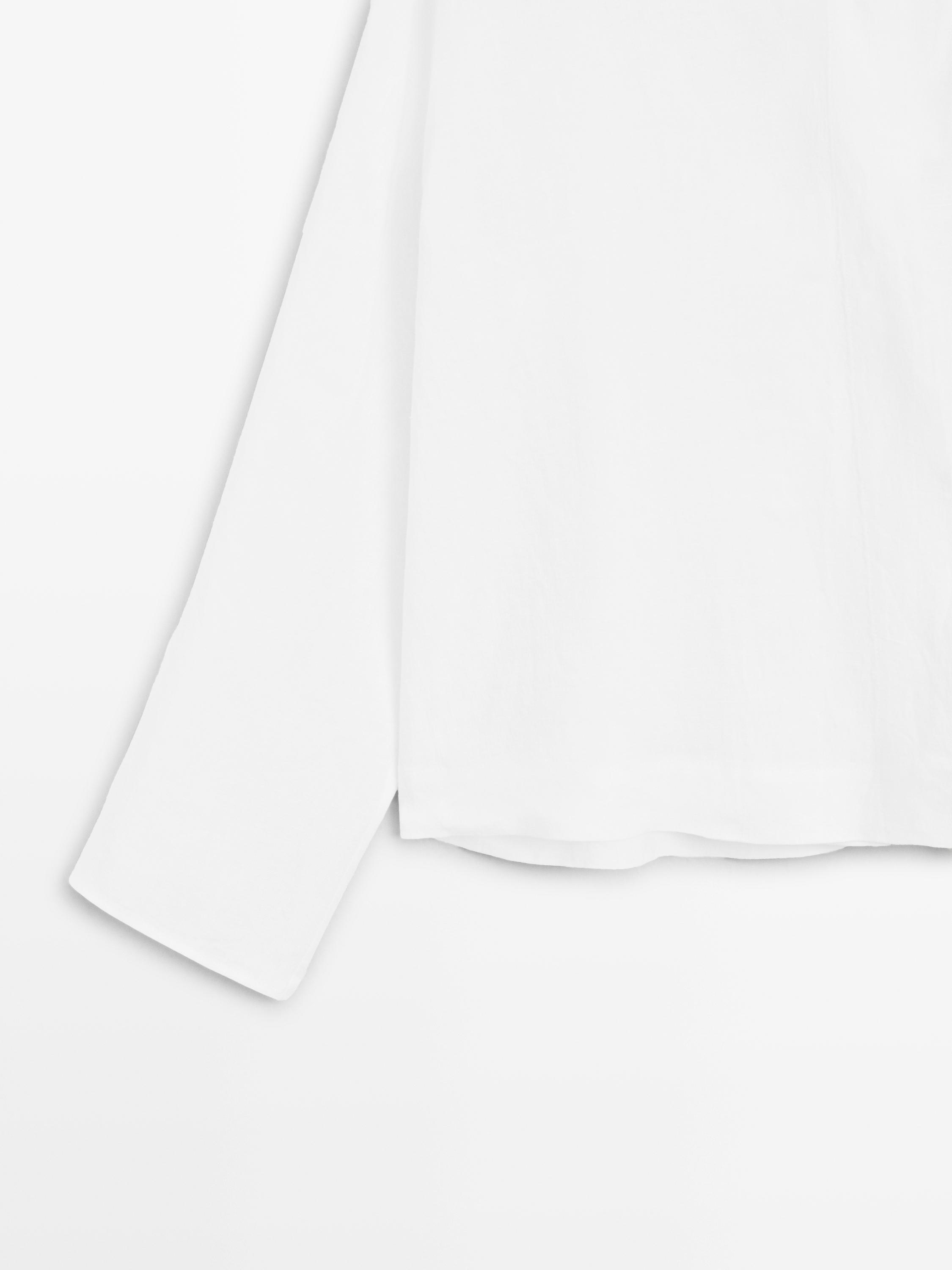Flowing linen blouse with surplice neckline